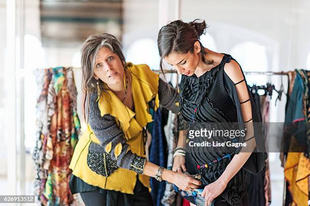 fashion designer making adjustment - lise gagne stock pictures, royalty-free photos & images