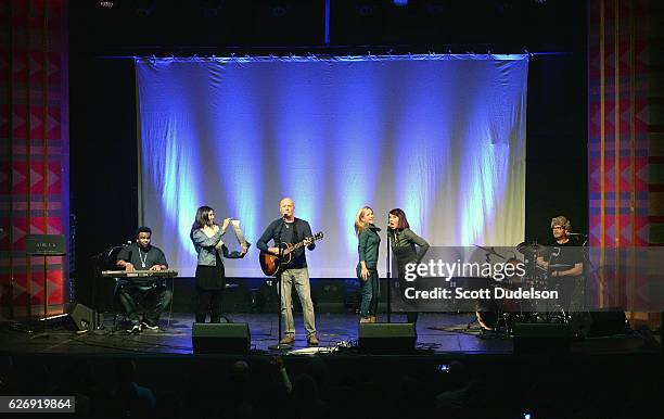 Actors/musicians Craig Robinson, Creed Bratton, Angela Kinsey, Kate Flannery and Rainn Wilson from the TV show The Office perform onstage during...