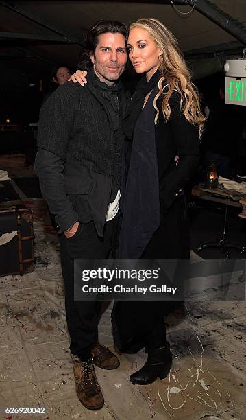 Greg Lauren and Elizabeth Berkley attend the Greg Lauren For Banana Republic Event at Greg Lauren Studio on November 30, 2016 in Los Angeles,...