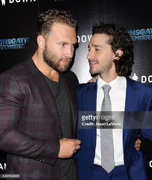 Actors Jai Courtney and Shia LaBeouf attend the premiere of "Man Down" at ArcLight Hollywood on November 30, 2016 in Hollywood, California.