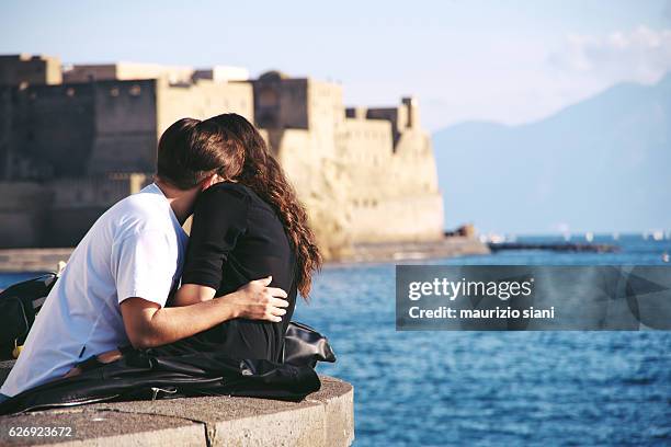 affectionate couple hugging face to face - african women naples stock pictures, royalty-free photos & images