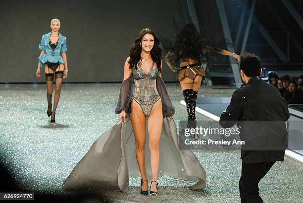 The Weeknd and Bella Hadid walk the runway at 2016 Victoria's Secret Fashion Show in Paris - Show at Le Grand Palais on November 30, 2016 in Paris,...