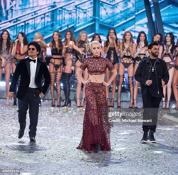 Singer Bruno Mars, Lady Gaga and The Weeknd perform during the runway during the 2016 Victoria's Secret Fashion Show at Le Grand Palais in Paris on...