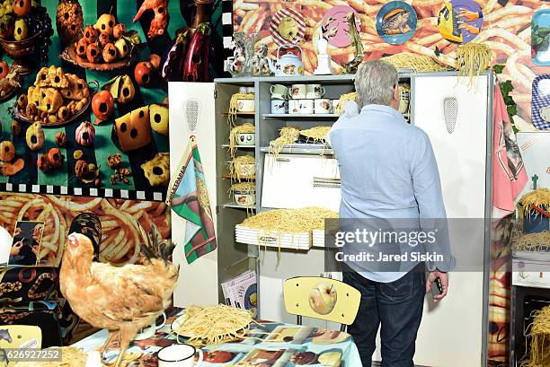 Guests browse Art Basel Miami Beach - VIP Preview at Miami Beach Convention Center on November 30, 2016 in Miami Beach, Florida.