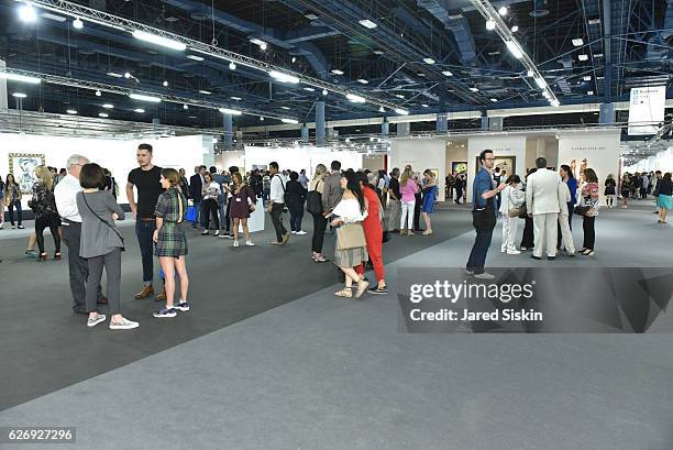 Guests browse Art Basel Miami Beach - VIP Preview at Miami Beach Convention Center on November 30, 2016 in Miami Beach, Florida.