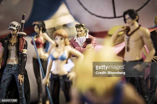 Toy figurines of Japanese manga characters are displayed at an Mtime.com Inc. Kiosk in Beijing, China, on Thursday, Nov. 24, 2016. Mtime, the movie...