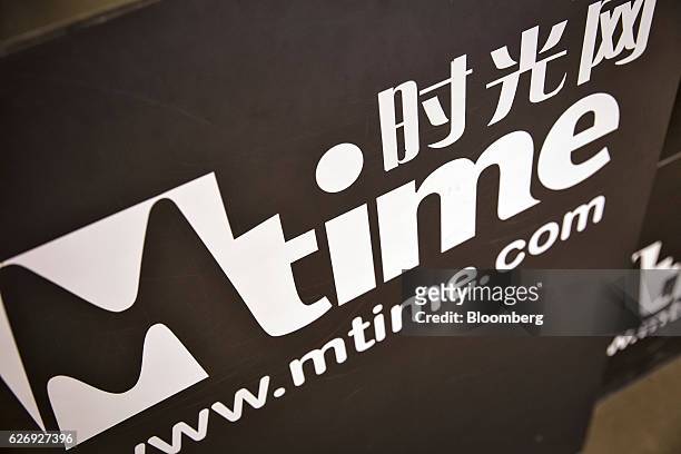 The Mtime.com Inc. Logo is displayed at one of the company's retail kiosks in a shopping mall in Beijing, China, on Thursday, Nov. 24, 2016. Mtime,...