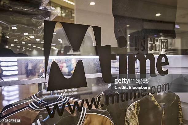The Mtime.com Inc. Logo is displayed on a window at one of the company's retail kiosks in a shopping mall in Beijing, China, on Thursday, Nov. 24,...