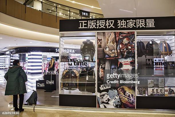 Shopper looks at an Mtime.com Inc. Kiosk in a shopping mall in Beijing, China, on Thursday, Nov. 24, 2016. Mtime, the movie portal and trinkets...
