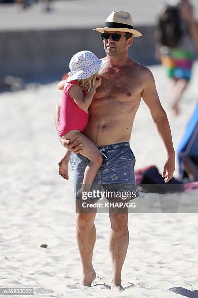 Steven Jacobs and his wife Rose pictured at the beach with their two daughters on November 13, 2016 in Sydney, Australia.