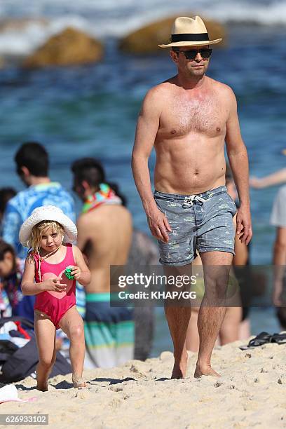Steven Jacobs and his wife Rose pictured at the beach with their two daughters on November 13, 2016 in Sydney, Australia.