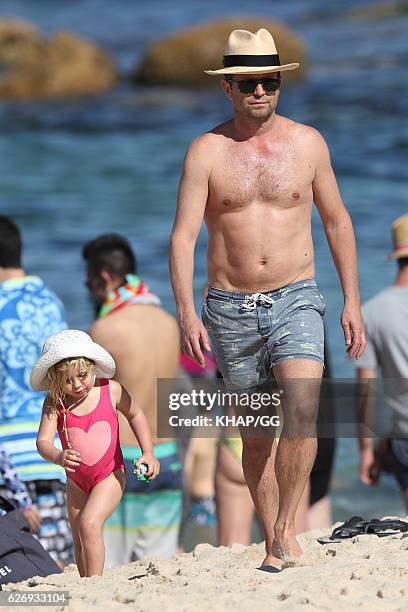 Steven Jacobs and his wife Rose pictured at the beach with their two daughters on November 13, 2016 in Sydney, Australia.