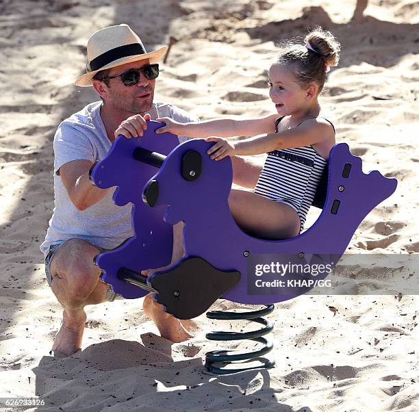 Steven Jacobs and his wife Rose pictured at the beach with their two daughters on November 13, 2016 in Sydney, Australia.