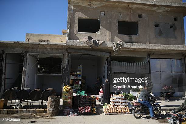 Civilian residents are seen during their daily life after Cobanbey town of Al-Bab District near Jarabulus District freed from Daesh terrorists by...