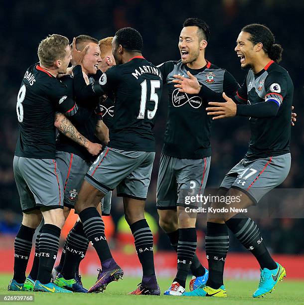 Southampton players celebrate after Jordy Clasie opens the scoring in their 2-0 away win at Arsenal in the quarterfinals of the League Cup in London...