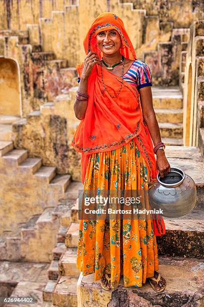 indian woman standing inside stepwell near jaipur, india - stepwell india 個照片及圖片檔