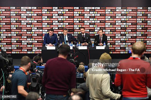 Senior Communications Manager Andy Walker , FA Chief Executive Martin Glenn and FA Technical Director Dan Ashworth look on as Gareth Southgate speaks...