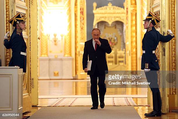Russian President Vladimir Putin enters the hall to deliver his annual speech to the Federal Assembly at Grand Kremlin Palace on December 2016 in...