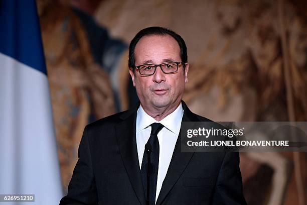 French President Francois Hollande delivers a speech after awarding the Legion of Honour to Olympic and Paralympic athletes at the Elysee...