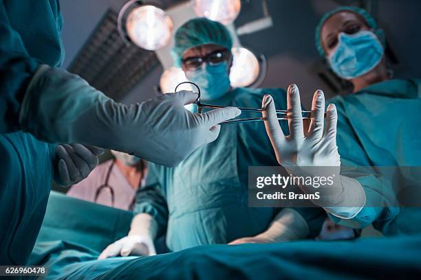 here are the surgical scissors doctor! - surgical scissors stock pictures, royalty-free photos & images