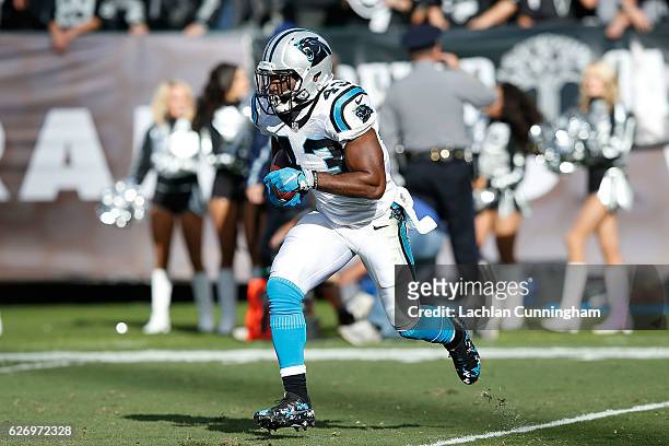 Fozzy Whittaker of the Carolina Panthers runs with the ball against the Oakland Raiders on November 27, 2016 in Oakland, California.