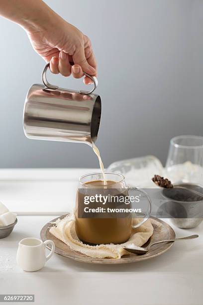 latte coffee in glass mug. - hand pouring stock pictures, royalty-free photos & images