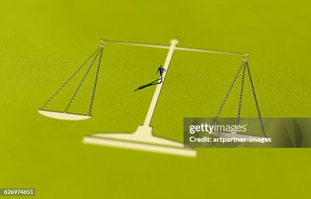 scale shaped path on the grass - justice concept stock pictures, royalty-free photos & images