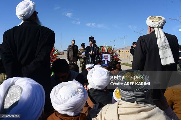 Afghan President Ashraf Ghani speaks after paying respects at the funeral service of commander of the 207th Corps, General Mohayedin Ghori in Herat...