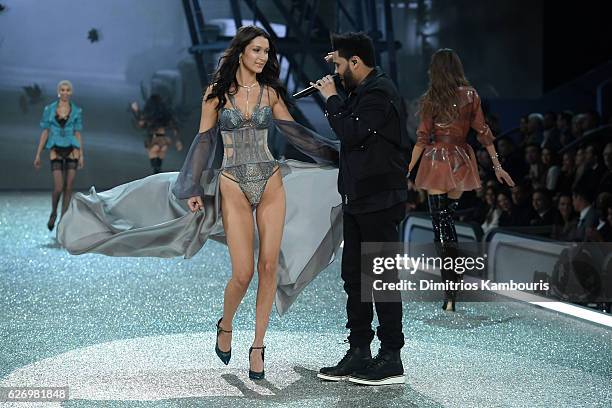 Bella Hadid walks the runway while The Weeknd performs during the 2016 Victoria's Secret Fashion Show on November 30, 2016 in Paris, France.