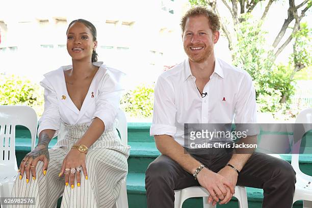 Singer Rihanna and Prince Harry speak on stage at the 'Man Aware' event held by the Barbados National HIV/AIDS Commission on the eleventh day of an...