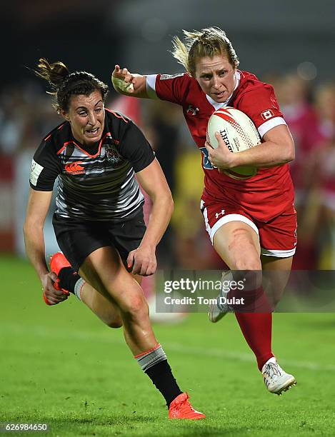 Kayla Moleschi of Canada and Alice Richardson of England in action during day one of the Emirates Dubai Rugby Sevens - HSBC World Rugby Women's...