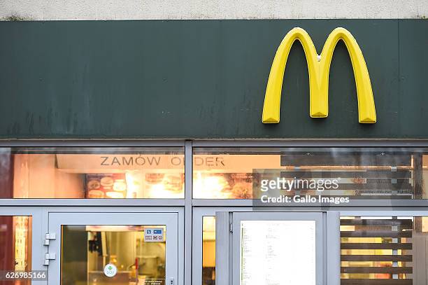 McDonald's restaurant logo on the building located in the city center on November 30, 2016 in Warsaw, Poland. Warsaw is home to many national...