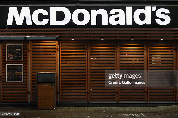 McDonald's restaurant logo on the building located in the city center on November 30, 2016 in Warsaw, Poland. Warsaw is home to many national...