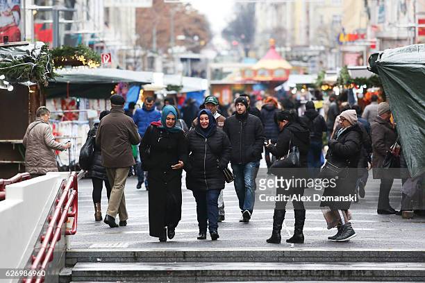 Women wearing headscarves walk on the street on December 1, 2016 in Vienna, Austria. Polls indicate that right-wing populist presidential candidate...