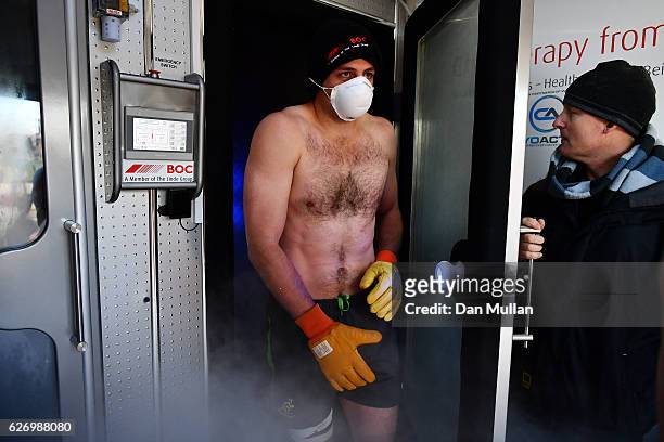 Dean Mumm of Australia emerges from a cyotherapy chamber following an Australia training session at Harrow School on December 1, 2016 in London,...