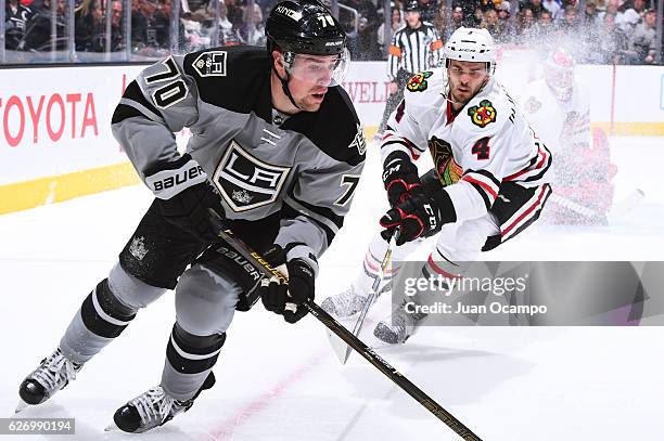 Tanner Pearson of the Los Angeles Kings skates against Niklas Hjalmarsson of the Chicago Blackhawks during the game on November 26, 2016 at Staples...