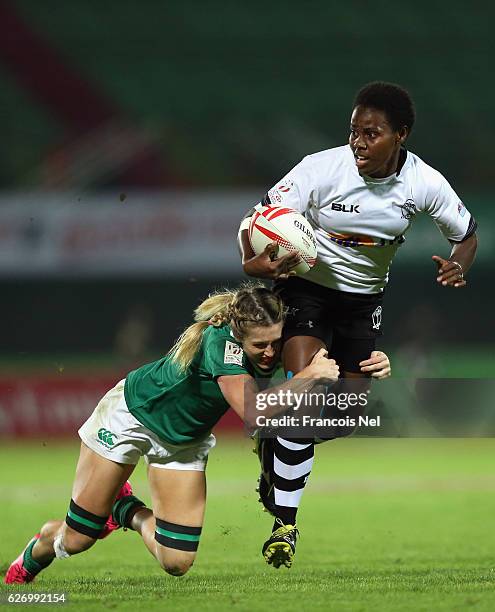 Raijieli Daveua of Fiji is tackled by Ashleigh Baxter of Ireland during day one of the Emirates Dubai Rugby Sevens - HSBC World Rugby Women's Sevens...