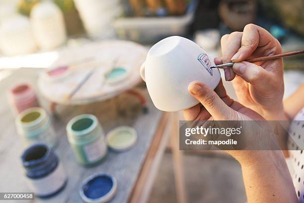 handmade with love - painting pottery stock pictures, royalty-free photos & images