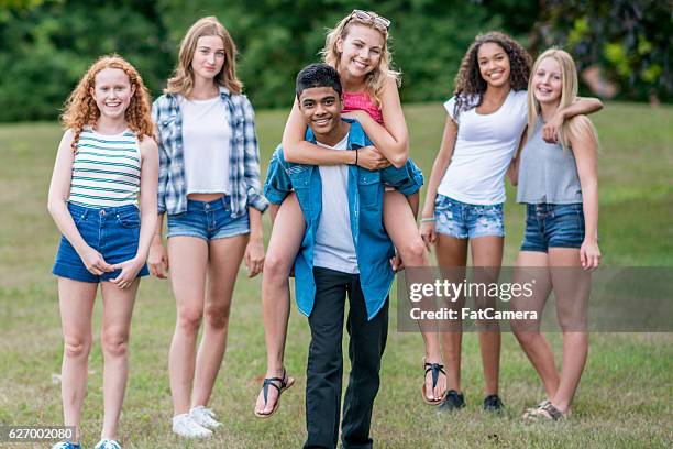 teenagers together at the park - teen boy shorts stock pictures, royalty-free photos & images