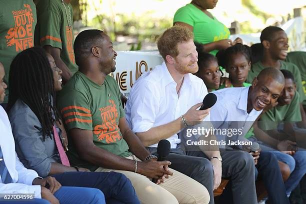 Prince Harry is seen on stage at 'Nature Fun Ranch' on the eleventh day of an official visit on December 1, 2016 in St Andrew, Barbados. The ranch...