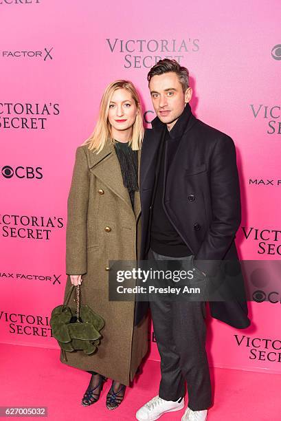 Guest and Guillaume Henry arrive at 2016 VictoriaÕs Secret Fashion Show held at Le Grand Palais on November 30, 2016 in Paris, France.