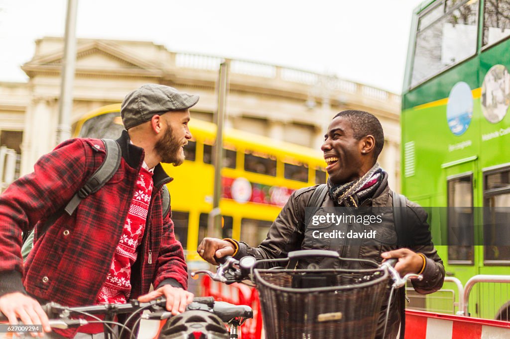Young Gay Men Tourist Couple at Irish Parliament With Bicycles