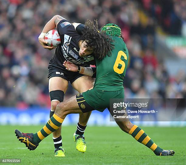 New Zealand's Kevin Proctor is tackled by Australia's Johnathan Thurston during the Four Nations match between the New Zealand Kiwis and Australian...