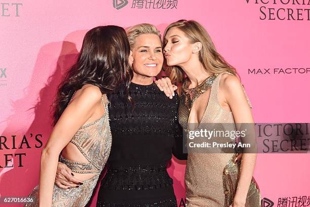 Bella Hadid, Yolanda Hadid and Gigi Hadid arrive at the 2016 Victoria's Secret Fashion Show Afterparty at Le Grand Palais on November 30, 2016 in...