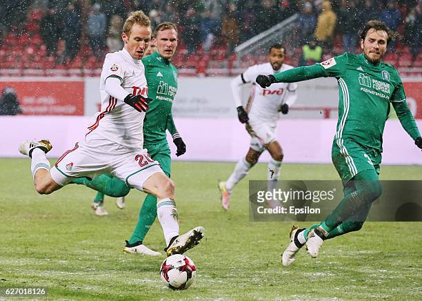 Vitaly Dyakov of FC Tom Tomsk and Vladislav Ignatyev of FC Lokomotiv Moscow vie for the ball during the Russian Football League match between FC Tom...