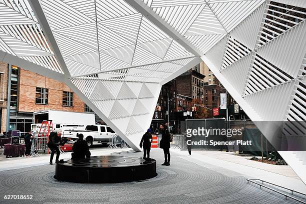People walk through a new memorial to honor victims of the AIDS epidemic which was dedicated on World AIDS Day on December 1, 2016 in New York City....