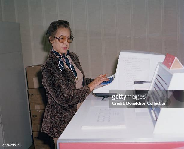 Space scientist, and mathematician Katherine Johnson poses for a portrait at work at NASA Langley Research Center in 1980 in Hampton, Virginia.