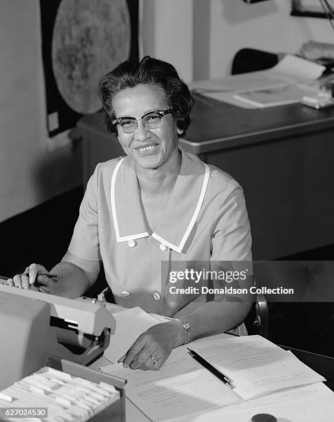 Space scientist, and mathematician Katherine Johnson poses for a portrait at work at NASA Langley Research Center in 1966 in Hampton, Virginia.