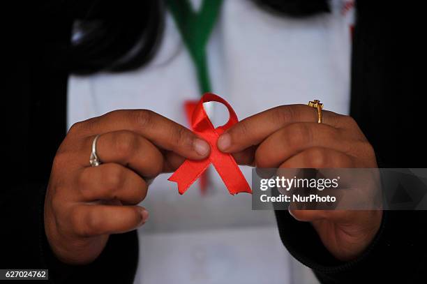 Nepalese youth shows AIDS symbol Red Ribbon on celebrates of 29th World AIDS Day in Kathmandu, Nepal on Thursday, December 1, 2016. World AIDS Day is...