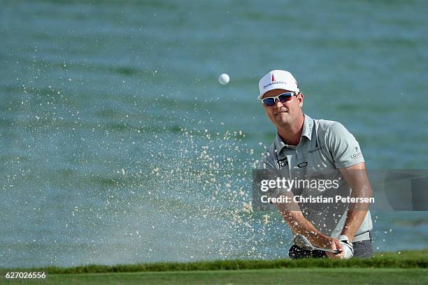 Zach Johnson of the United States plays a shot from a greenside bunker on the ninth hole during round one of the Hero World Challenge at Albany, The...